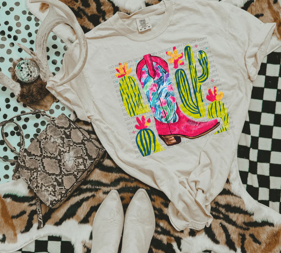 Pink cowboy boot and cactus