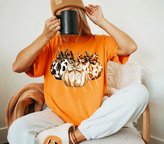 Three cow print pumpkins